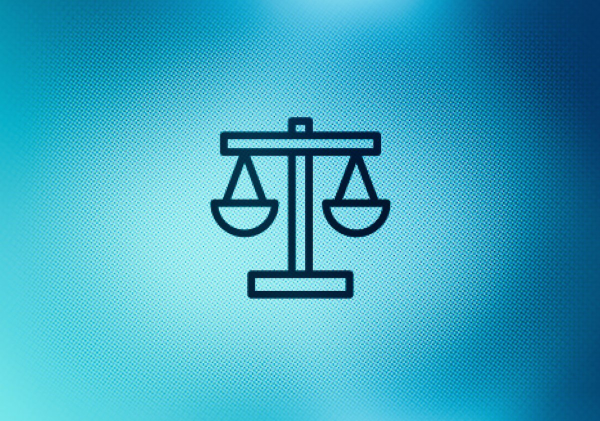 Close up of justice scales icon on screen