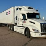 Image from front of white Peterbilt truck with Waabi logo and branding