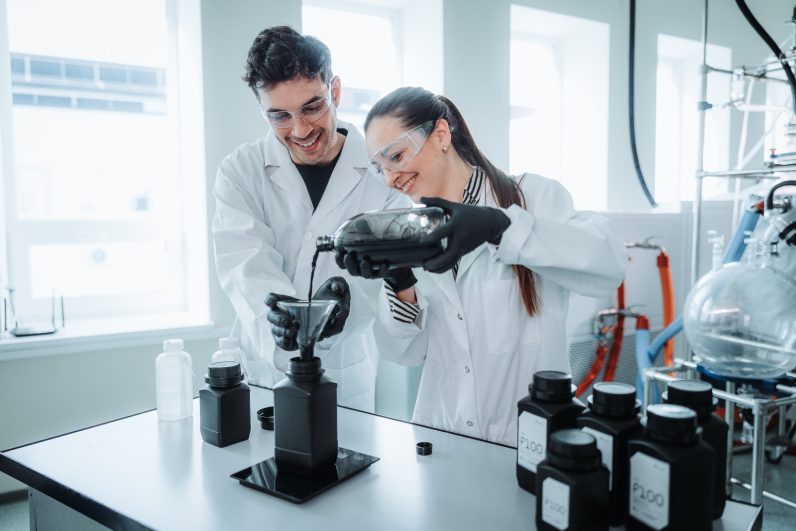 Two scientists inside the lab of Up Catalyst, which transforms CO2 emissions into green carbon products 