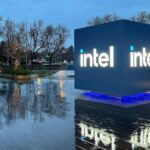 Intel Headquarters Robert Noyce Building in Santa Clara, California at night with Intel sign lit up.