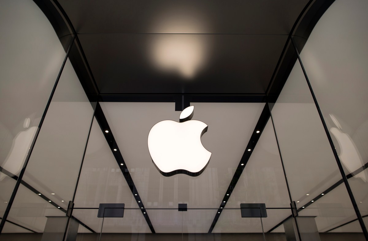 The Apple logo hangs above the entrance to the Apple Shinjuku store