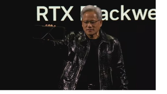 Jensen Huang holds an RTX Blackwell.