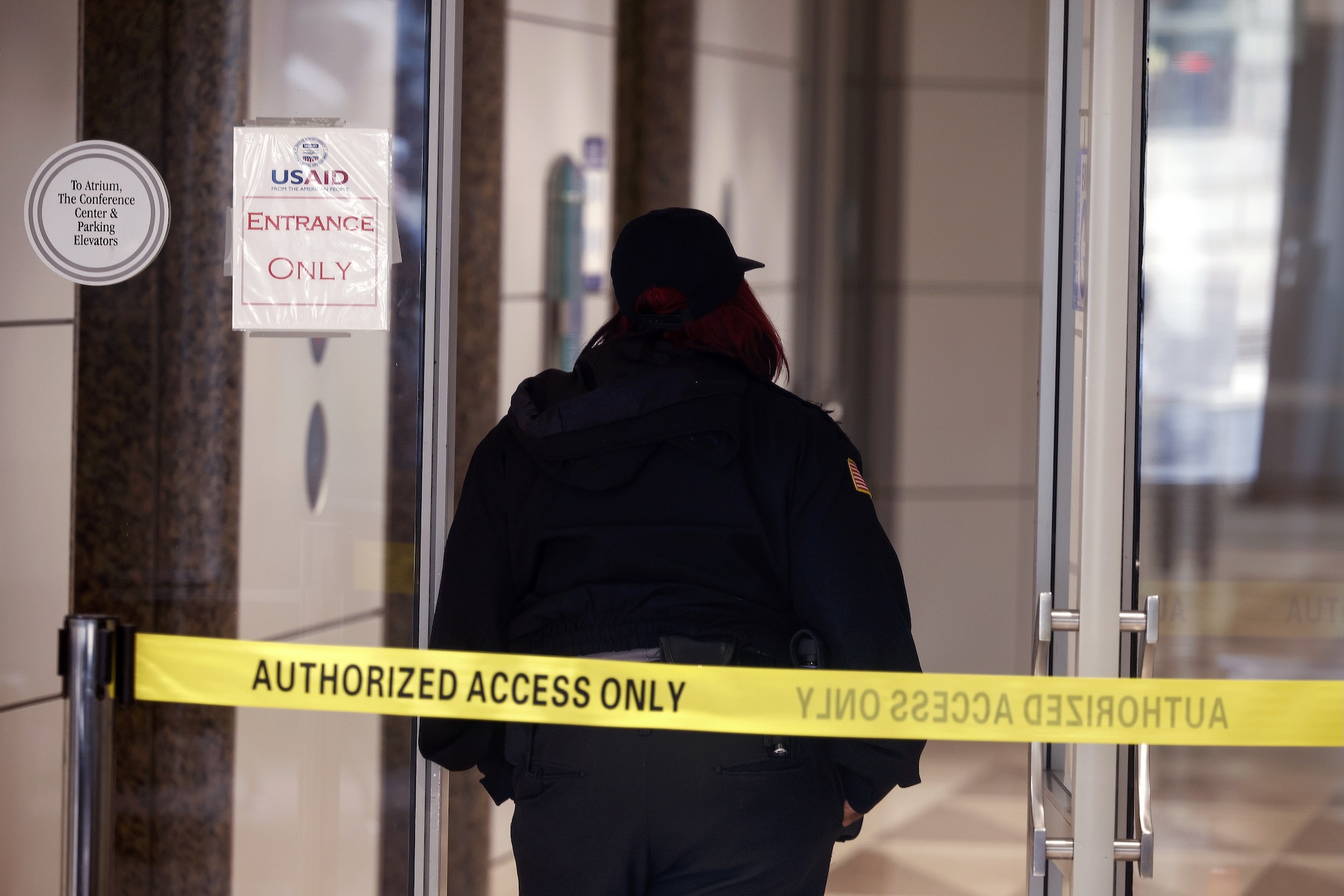 A security guard stands at the entrance to the USAID headquarters on February 03, 2025 in Washington, DC