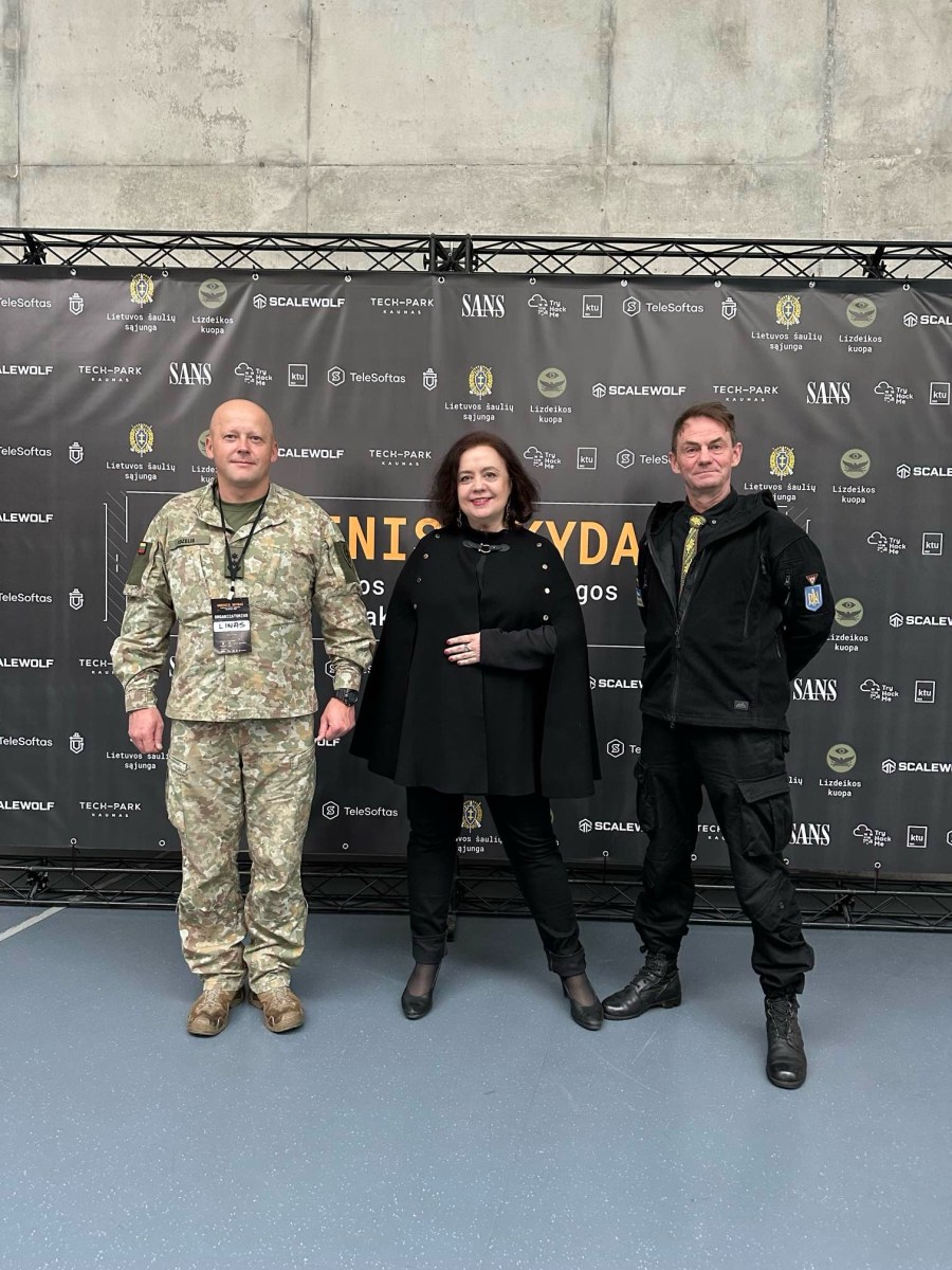 Coinvest Capital managing partner Viktorija Trimbel with Lieutenant Colonel Linas Idzelis (in uniform) and Lieutenant Colonel (retired) Valerijus Šerelis at the 'Fire Shield' hackathon