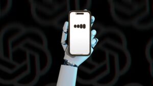 white robotic hand holding a phone with OpenAI's GPT-4o on the screen